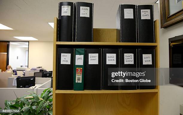 Binders in book shelves house court cases in Quincy District Court.