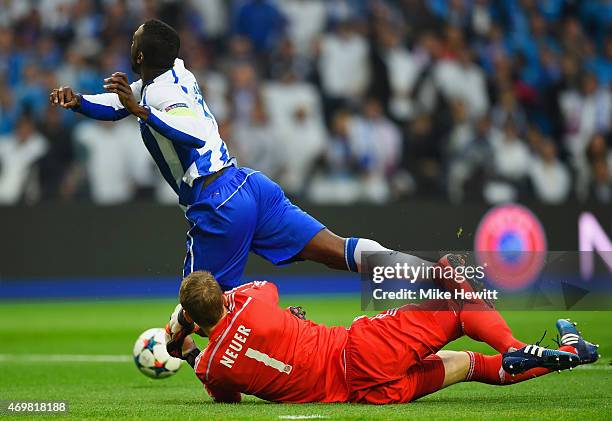 Goalkeeper Manuel Neuer of Bayern Muenchen fouls Jackson Martinez of FC Porto to concede a penalty kick during the UEFA Champions League Quarter...