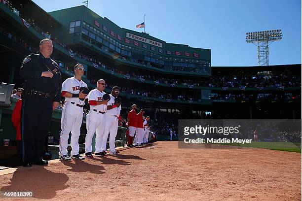 Members of the Boston Red Sox stand for a moment of silence during the fourth inning against the Washington Nationals to commemorate the two year...