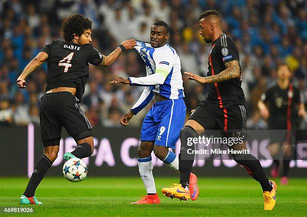 Jackson Martinez of FC Porto battles with Dante and Jerome Boateng of Bayern Muenchen during the UEFA Champions League Quarter Final first leg match...