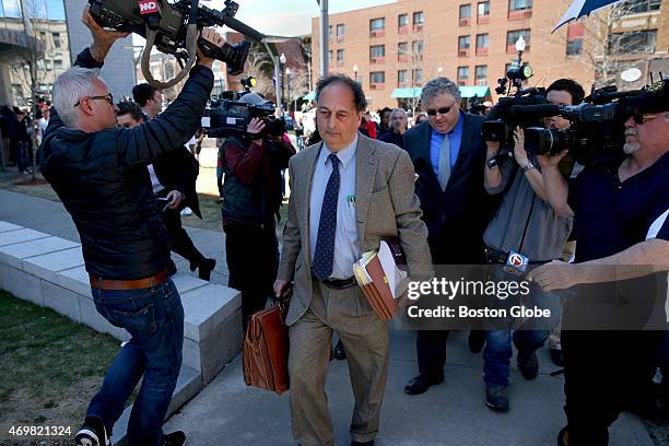 Aaron Hernandez's defense attorneys James Sultan, front, and Michael Fee, rear, left court without taking questions after their client was convicted...