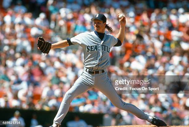 Pitcher Randy Johnson of the Seattle Mariners pitches against the Oakland Athletics during a Major League Baseball game circa 1993 at the...