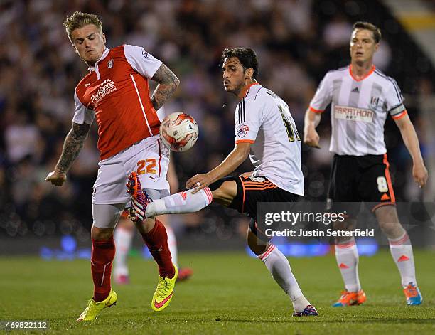 Danny Ward of Rotherham United battles with Bryan Ruiz of Fulham during the Sky Bet Championship match between Fulham and Rotherham United at Craven...
