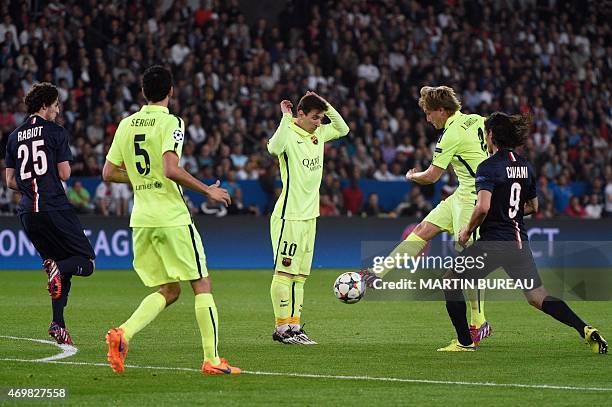 Paris Saint-Germain's Uruguayan forward Edinson Cavani vies with Barcelona's Croatian midfielder Ivan Rakitic next to Barcelona's Argentinian forward...