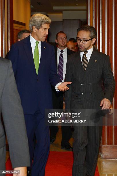 Indonesian Foreign Minister Marty Natalegawa walks with US Secretary of State John Kerry before the US-Indonesia fourth Joint Commision Meeting at...
