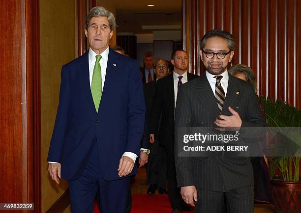 Indonesian Foreign Minister Marty Natalegawa walks with US Secretary of State John Kerry before the US-Indonesia fourth Joint Commision Meeting at...