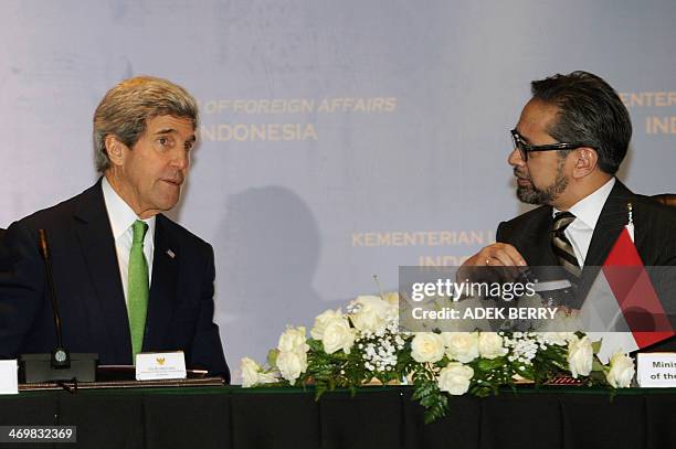Indonesian Foreign Minister Marty Natalegawa talks to US Secretary of State John Kerry during the US-Indonesia fourth Joint Commision Meeting at the...