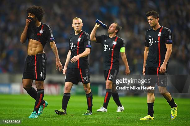 Dante, Sebastian Rode, Philipp Lahm and Robert Lewandowski of Bayern Muenchen look dejected in defeat after the during the UEFA Champions League...