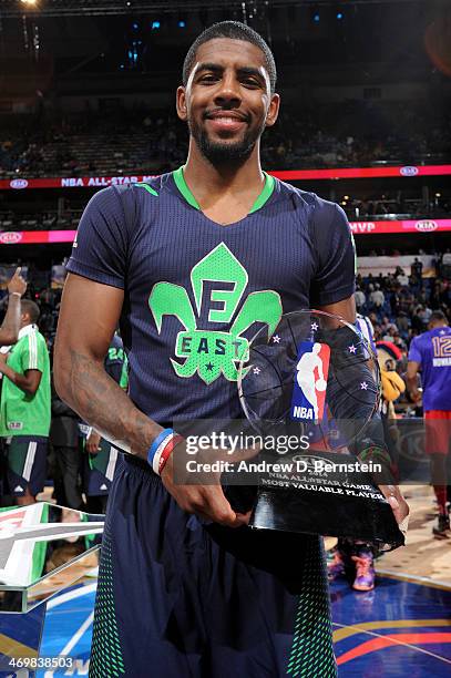 Kyrie Irving of the Eastern Conference All-Stars holds the MVP trophy after the 2014 NBA All-Star Game as part of the 2014 All-Star Weekend at...