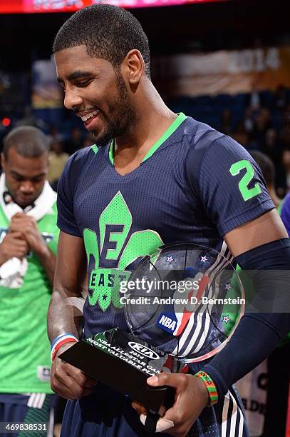 Kyrie Irving of the Eastern Conference All-Stars holds the MVP trophy after the 2014 NBA All-Star Game as part of the 2014 All-Star Weekend at...