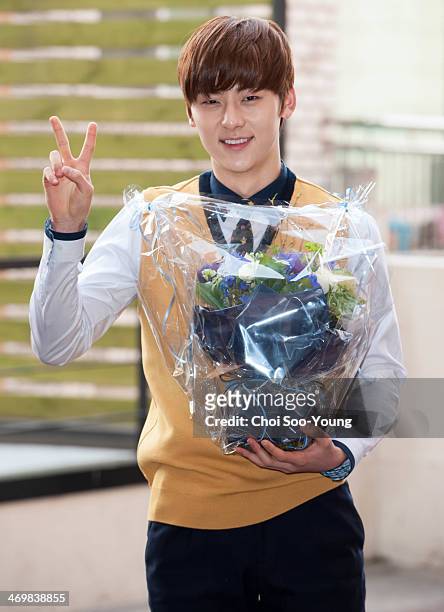 Min-Hyun of NU'EST attends the School of Performing Arts Seoul graduation on February 13, 2014 in Seoul, South Korea.