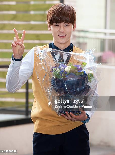 Min-Hyun of NU'EST attends the School of Performing Arts Seoul graduation on February 13, 2014 in Seoul, South Korea.