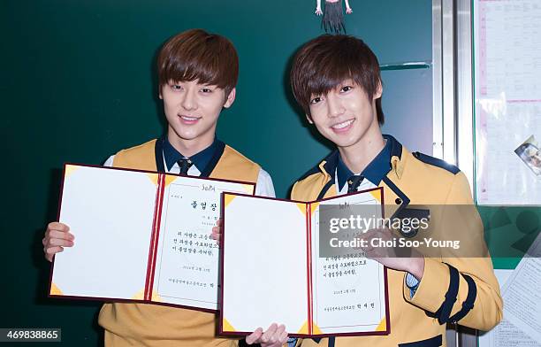 Min-Hyun of NU'EST and Young-Min of BOYFRIEND attend the School of Performing Arts Seoul graduation on February 13, 2014 in Seoul, South Korea.