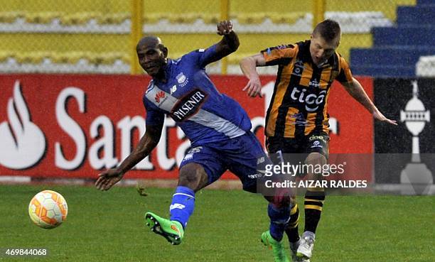 Alejandro Chumacero of Bolivia's Strongest and Oscar Bagui of Emelec of Ecuador vie for the ball during their Libertadores Cup football match in La...
