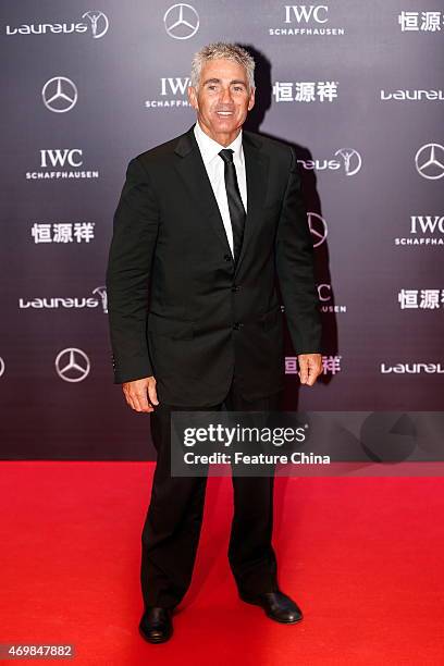 Laureus World Sports Academy member Mick Doohan poses on the red carpet for the Laureus World Sports Awards ceremony at the Grand Theater on April...