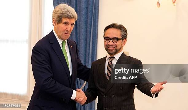 Secretary of State John Kerry is greeted by Indonesian Foreign Minister Marty Natalegawa at the Pancasila in Jakarta on February 17, 2014. Kerry...