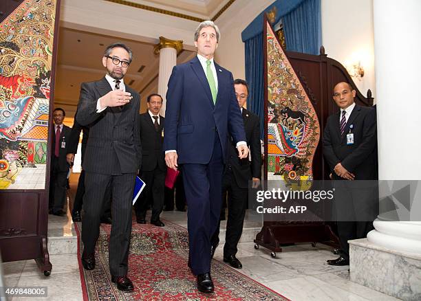 Secretary of State John Kerry and Indonesian Foreign Minister Marty Natalegawa arrive to attend a news conference at the Pancasila in Jakarta on...
