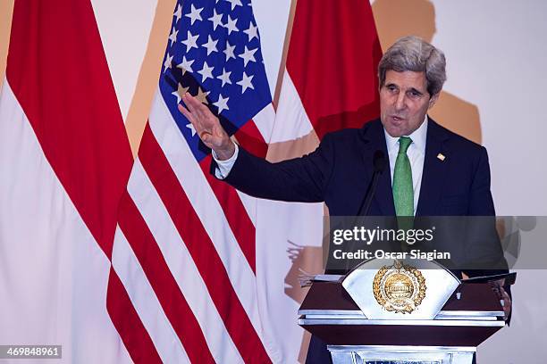 Secretary of State John Kerry gestures during a joint press conference with Indonesian Foreign Minister Marty Natalegawa on February 17, 2014 in...