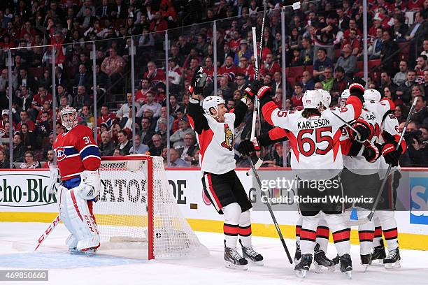 Members of the Ottawa Senators celebrate the first period goal by Milan Michalek in Game One of the Eastern Conference Quarterfinals during the 2015...