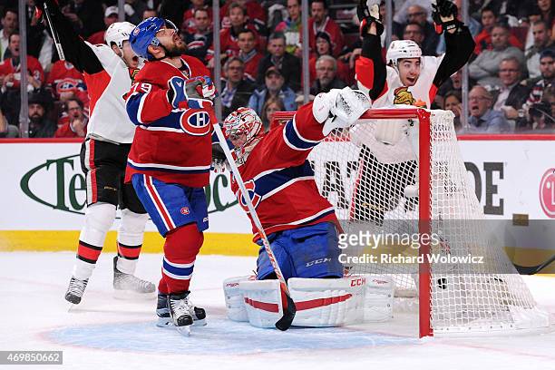 The puck gets past Carey Price of the Montreal Canadiens on a shot by Milan Michalek of the Ottawa Senators in Game One of the Eastern Conference...