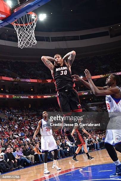 Michael Beasley of the Miami Heat dunks the ball against the Philadelphia 76ers at Wells Fargo Center on April 15, 2015 in Philadelphia, Pennsylvania...