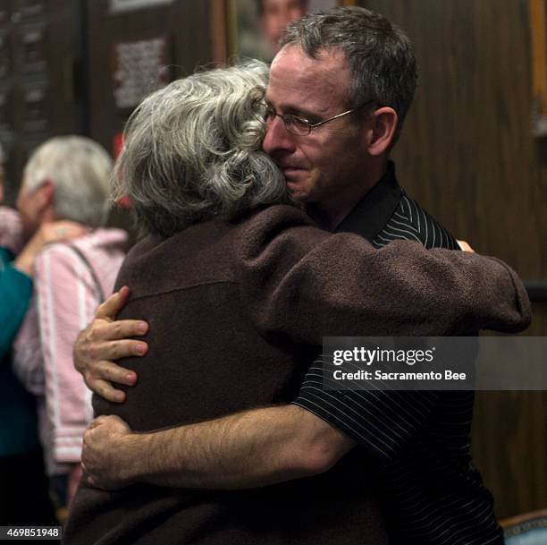 Scott Harris, right, the son of Robert Edward "Bob" Harris, hugs his aunt, Nancy Glaberman, as Colleen Ann Harris is found guilty of murdering his...