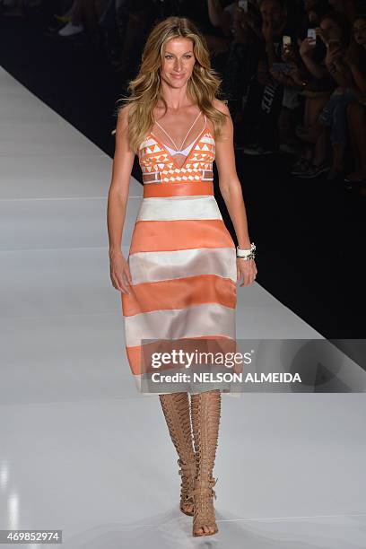 Brazilian supermodel Gisele Bundchen presents a creation by Colcci during the 2016 Summer collections of the Sao Paulo Fashion Week in Sao Paulo,...