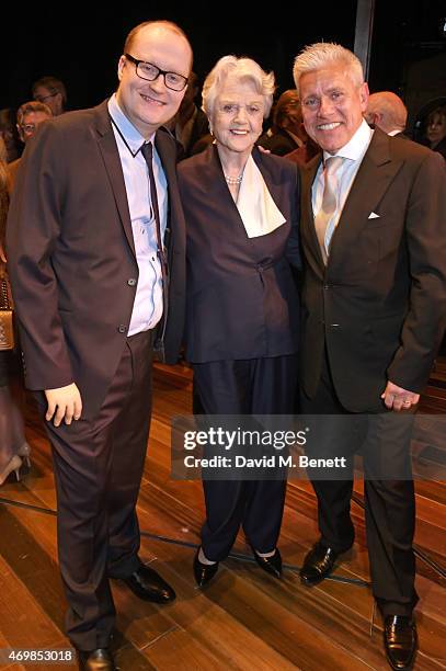 Dame Angela Lansbury poses with producers Michael Harrison and David Ian at a post show drinks reception on stage following the press night...