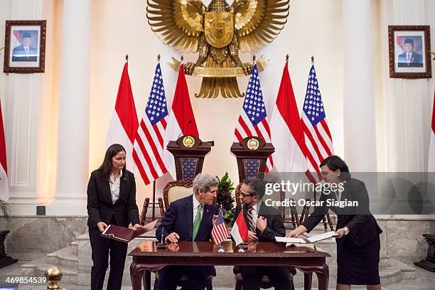 Indonesian Foreign Minister Marty Natalegawa and U.S. Secretary of State John Kerry speak during a signing of a Memorandum of Understanding regarding...