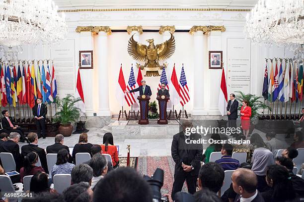 Secretary of State John Kerry answers questions from the media during a joint press conference with Indonesian Foreign Minister Marty Natalegawa on...