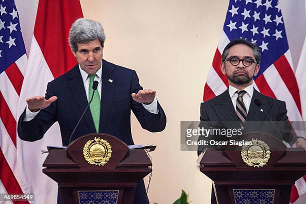 Secretary of State John Kerry gestures during a joint press conference with Indonesian Foreign Minister Marty Natalegawa on February 17, 2014 in...