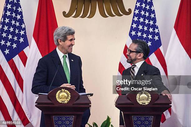 Secretary of State John Kerry talks with Indonesian Foreign Minister Marty Natalegawa during a joint press conference on February 17, 2014 in...
