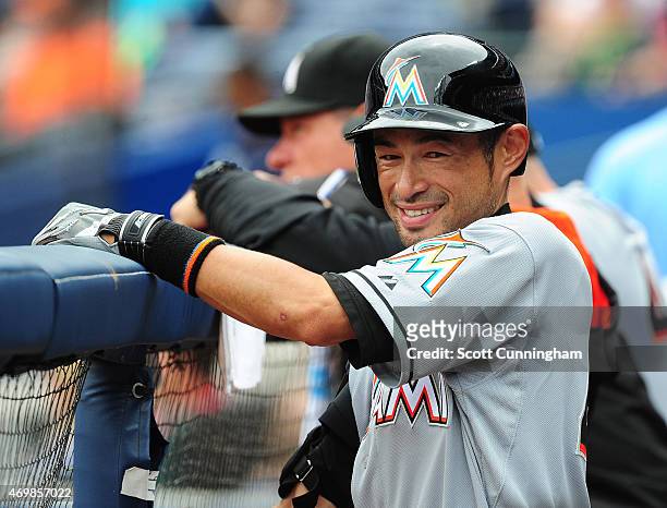 Ichiro Suzuki of the Miami Marlins relaxes in the dugout during the fourth inning against the Atlanta Braves at Turner Field on April 15, 2015 in...