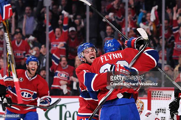 Brian Flynn of the Montreal Canadiens celebrates his second period goal with teammate Torrey Mitchell in Game One of the Eastern Conference...