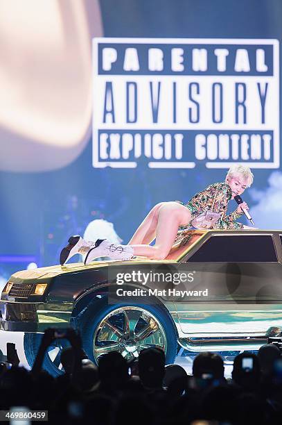 Miley Cyrus performs on stage during her 'Bangerz Tour' at the Tacoma Dome on February 16, 2014 in Tacoma, Washington.