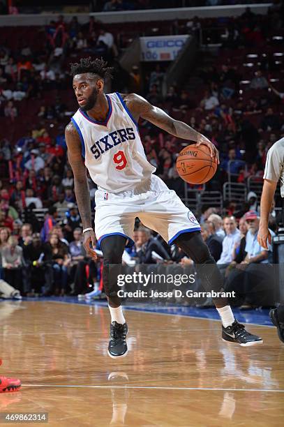 JaKarr Sampson of the Philadelphia 76ers dribbles up court against the Miami Heat at Wells Fargo Center on April 15, 2015 in Philadelphia,...