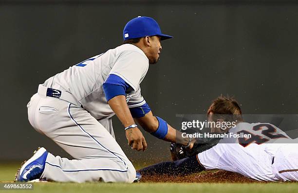 Alcides Escobar of the Kansas City Royals catches Jordan Schafer of the Minnesota Twins stealing second base during the eighth inning of the game on...