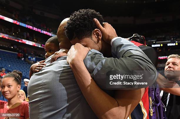 Anthony Davis embraces head coach Monty Williams after the New Orleans Pelicans clinch a playoff berth with a victory over the San Antonio Spurs at...