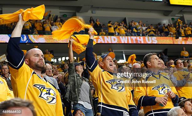 Nashville Predators fans give a standing ovation during a break in play against the Chicago Blackhawks in Game One of the Western Conference...