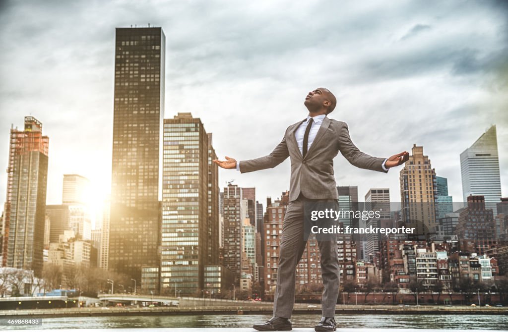 Successful business man looking away against the skyline