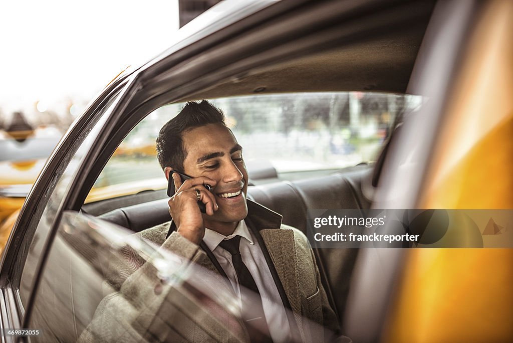 Businessman on a yellow cab
