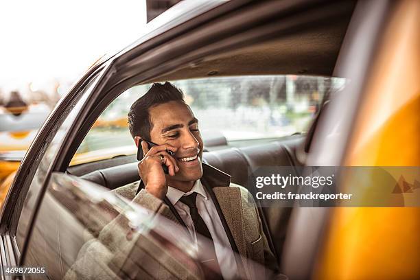 businessman on a yellow cab - indian ethnicity man car stock pictures, royalty-free photos & images