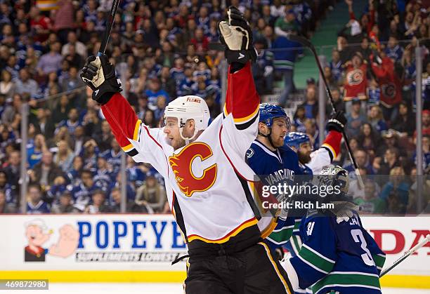 Matt Stajan of the Calgary Flames celebrates teammates David Jones goal against the Vancouver Canucks in Game One of the Western Conference...