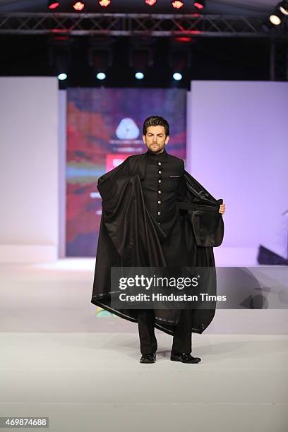 Bollywood actor Neil Nitin Mukesh walks on the ramp during the fashion party hosted by Australian High Commissioner Patrick Suckling to welcome Julie...