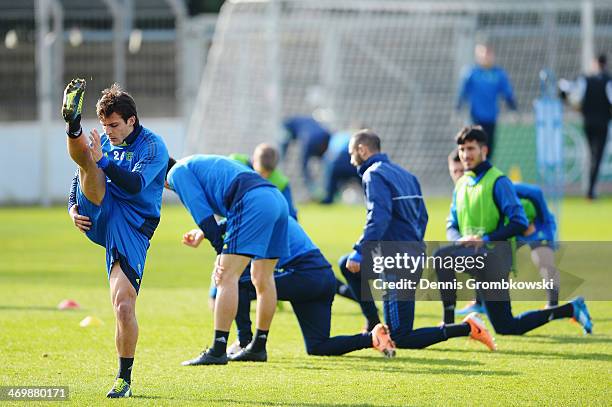 Giulio Donati of Bayer Leverkusen stretches during a training session ahead of the UEFA Champions League match between Bayer Leverkusen and Paris...