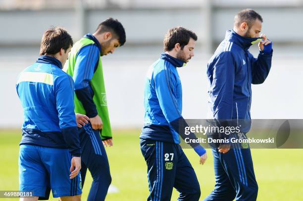 Bayer Leverkusen players react during a training session ahead of the UEFA Champions League match between Bayer Leverkusen and Paris Saint-Germain on...