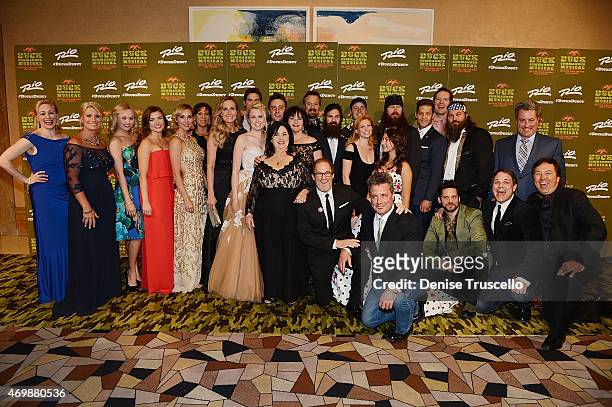 The cast of Duck Dynasty pose with cast members of "Duck Commander Musical" at the world premiere at Rio All Suite Hotel & Casino on April 15, 2015...