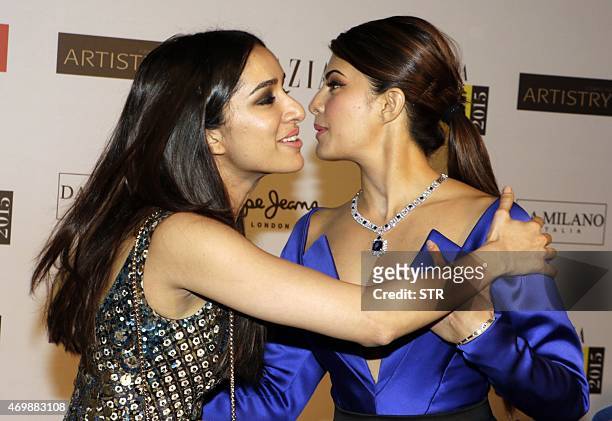 Indian Bollywood actresses Shraddha Kapoor and Jacqueline Fernandez greet at the 'Grazia Young Fashion Awards 2015' ceremony in Mumbai on April 15,...