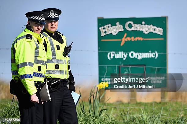 Police at the scene near High Craigton Farm on the outskirts of Milngavie, north of Glasgow, which has been cordoned off following the discovery of...