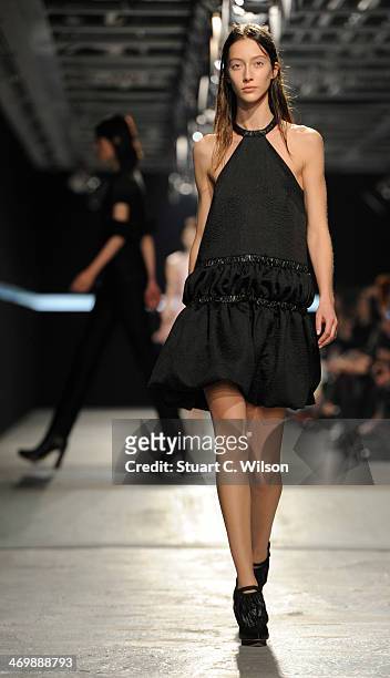 Model walks the runway at the Christopher Kane show at London Fashion Week AW14 at on February 17, 2014 in London, England.
